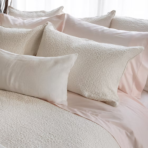 Textured pillows on a bed with Athena Jacquard Duvet Cover Set bedding