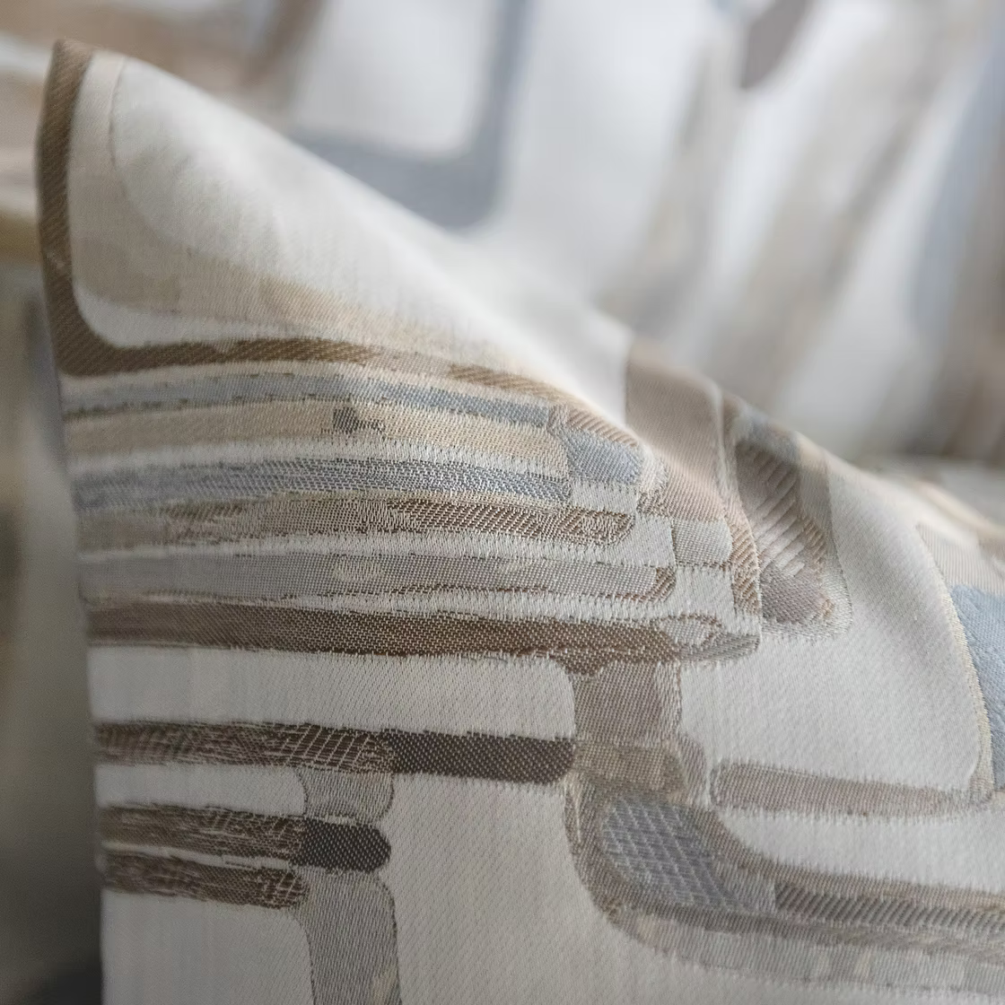 Close-up of a textured fabric with horizontal stripes in neutral colors and Fjord pattern.