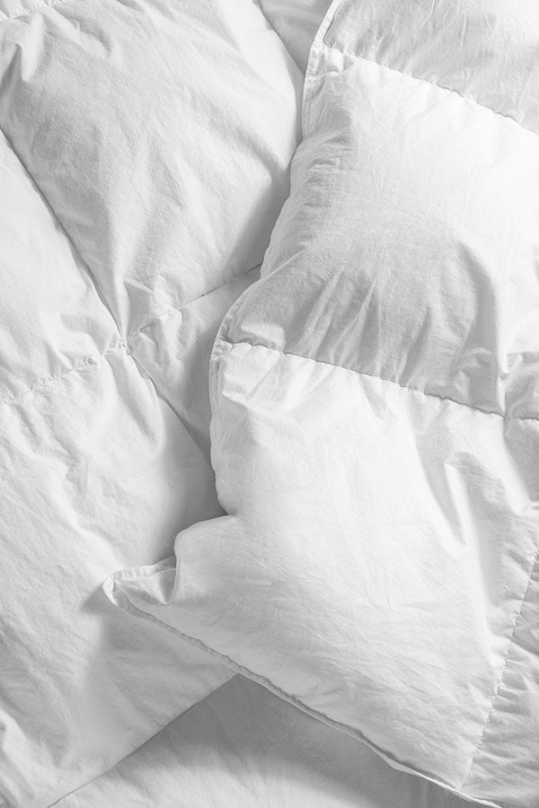 Closeup of a neatly crafted seam on a down duvet.