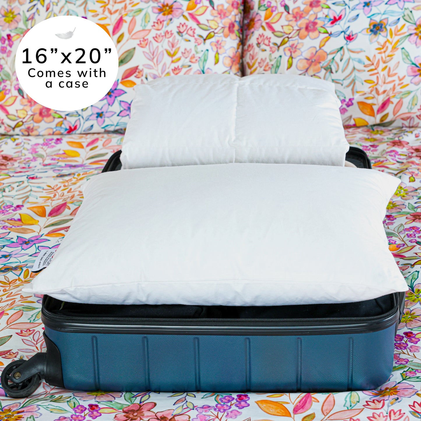 Travel pillow laid flat on a open suitcase.