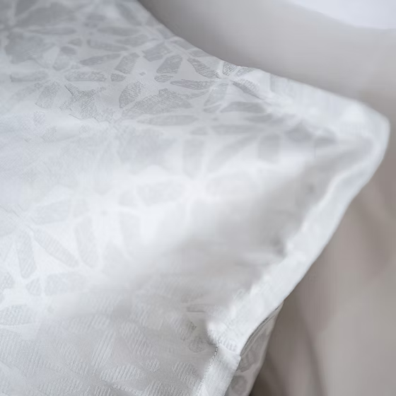 White textured Aura Sham on a neutral background