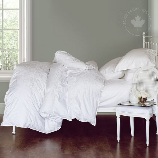 White James Bay Duvet (Jacuard Cover) on a bed in a bedroom with a side table and decor.