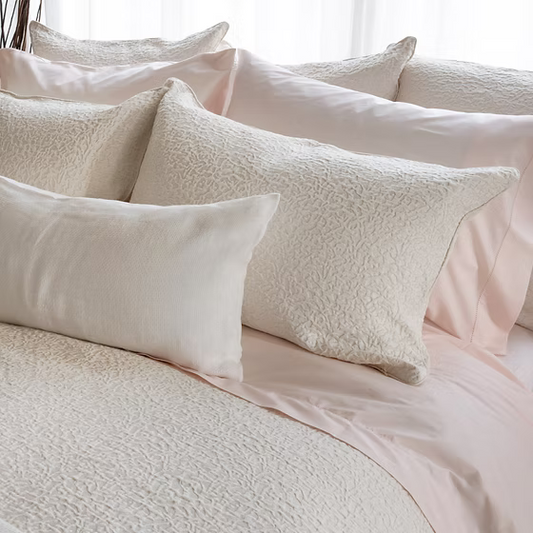 Textured pillows on a bed with Athena Jacquard Duvet Cover set bedding