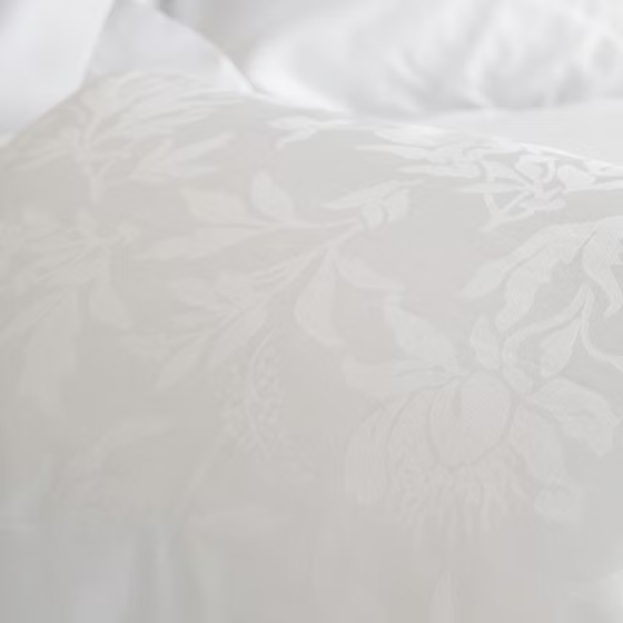 Close-up of white Giza 92 Flora | Jacquard bedding with subtle texture
