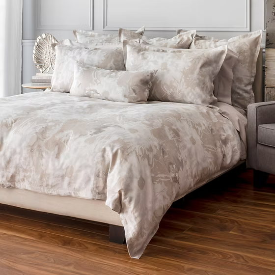 Neatly made bed with Blossom Jacquard Duvet Covers set in a bedroom setting.
