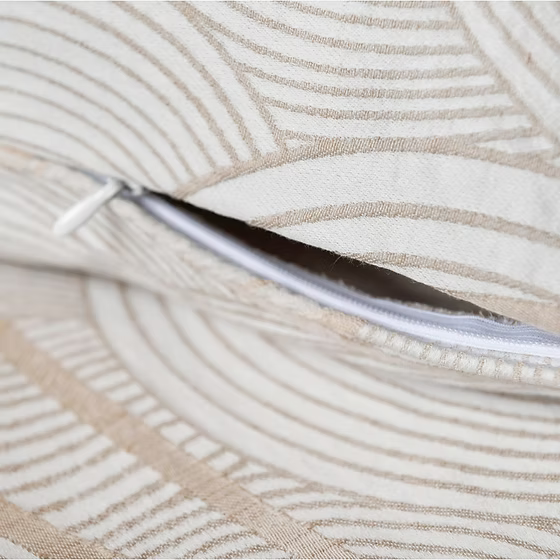 Close-up of a textured fabric of a Saturna Jacquard with a zipper running through it