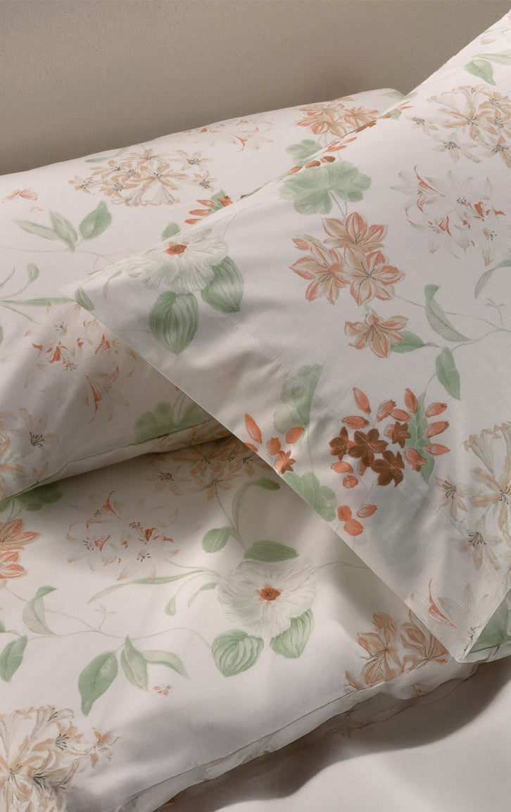 Floral-patterned Brillante Duvet Covers ,Shams  on a bed with a neutral background
