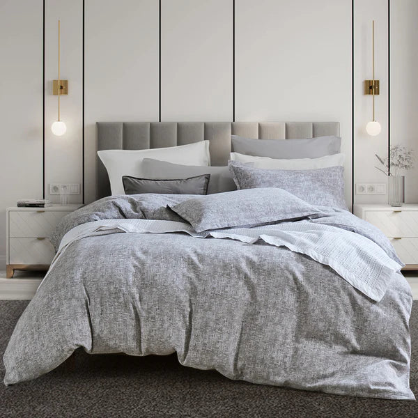 Gray Malaga Duvet Cover Set on a bed in a modern bedroom with neutral walls and decor.