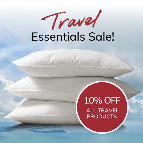A graphic for Travel Essentials Sale with a 10% off offer and a stack of white pillows with a 'Travel Essentials Sale!' text on a blue sky background.
