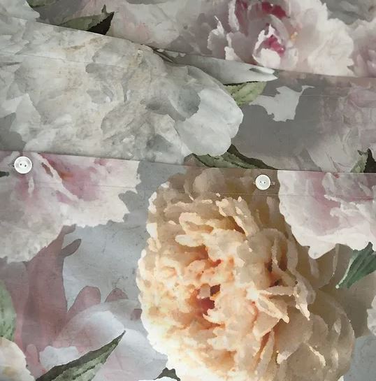 A closeup on a floral fabric of a Bijoux Duvet Cover