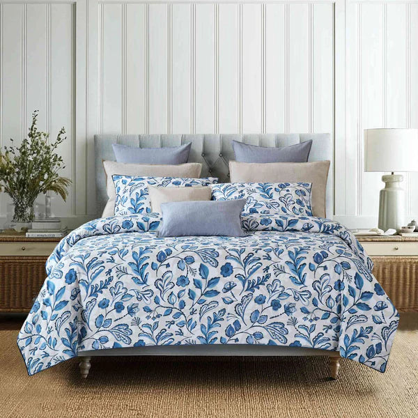 Bed with blue floral Canopy Duvet Cover Set bedding in a bedroom setting