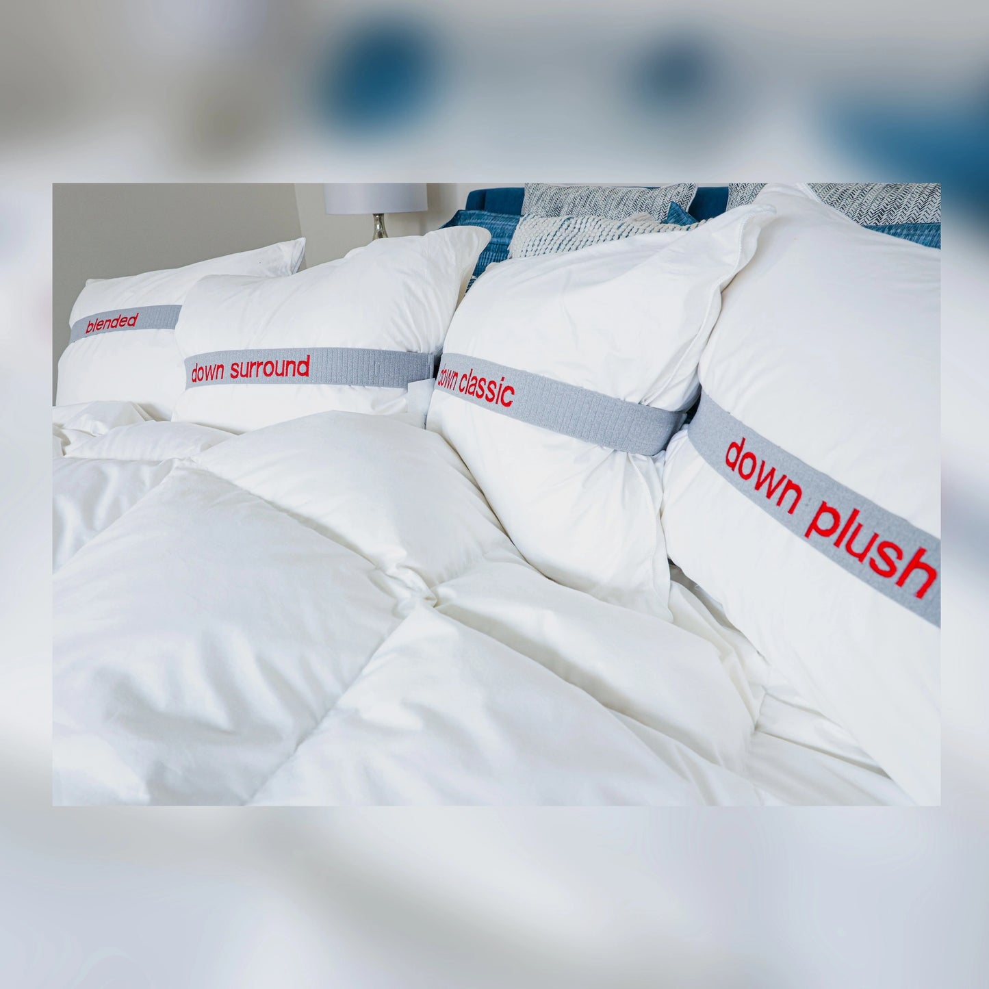 Guildcraft down pillows shown on a bed.