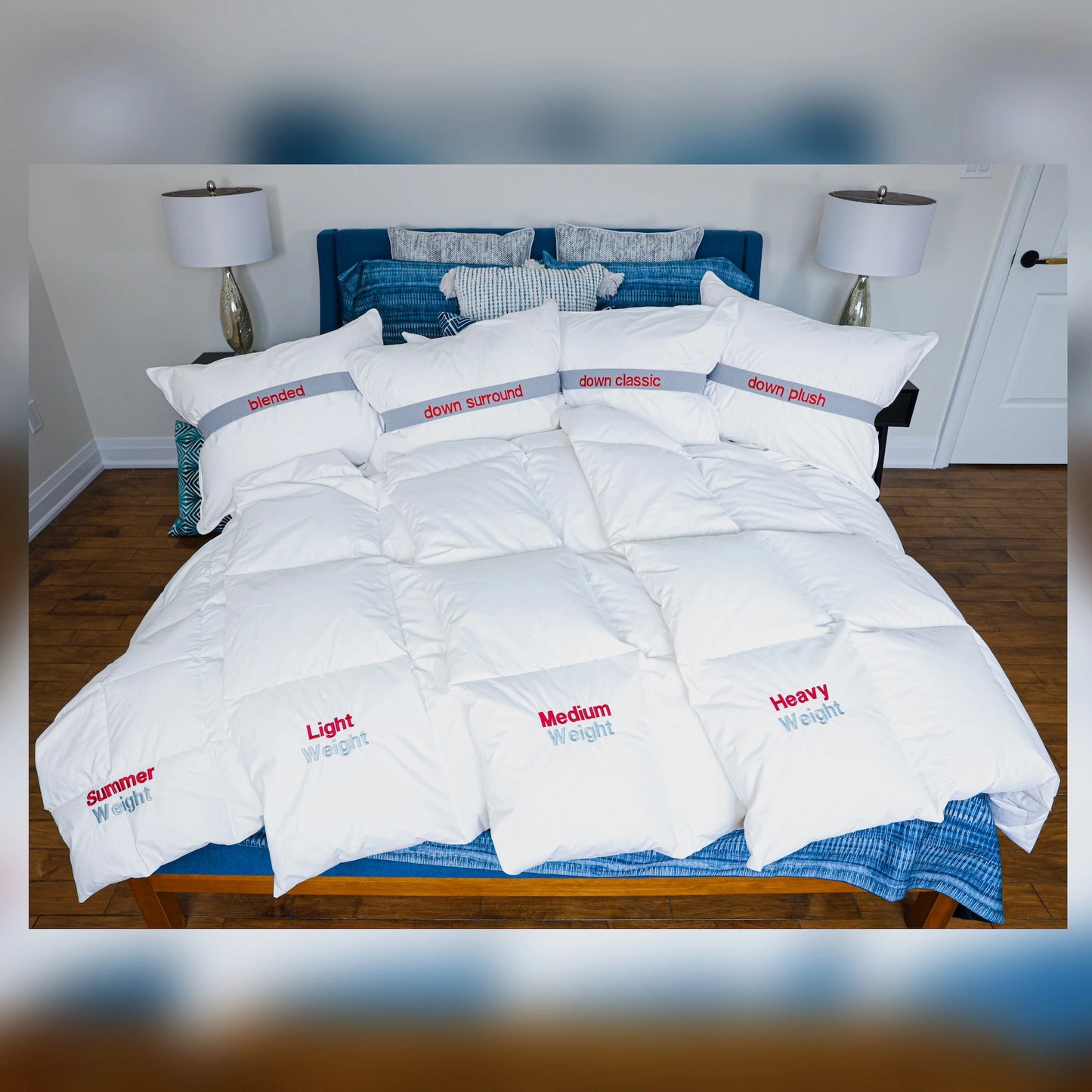 Lineups of down duvets of all weights on a bed with blue bedding.