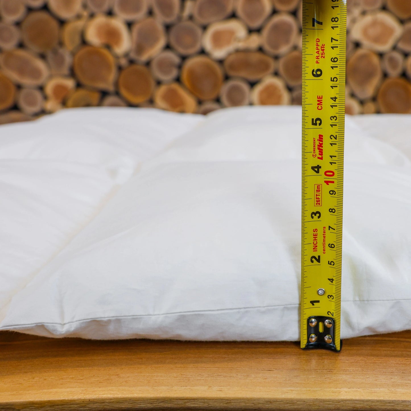 Measure showing thickness of the light weight down duvet.