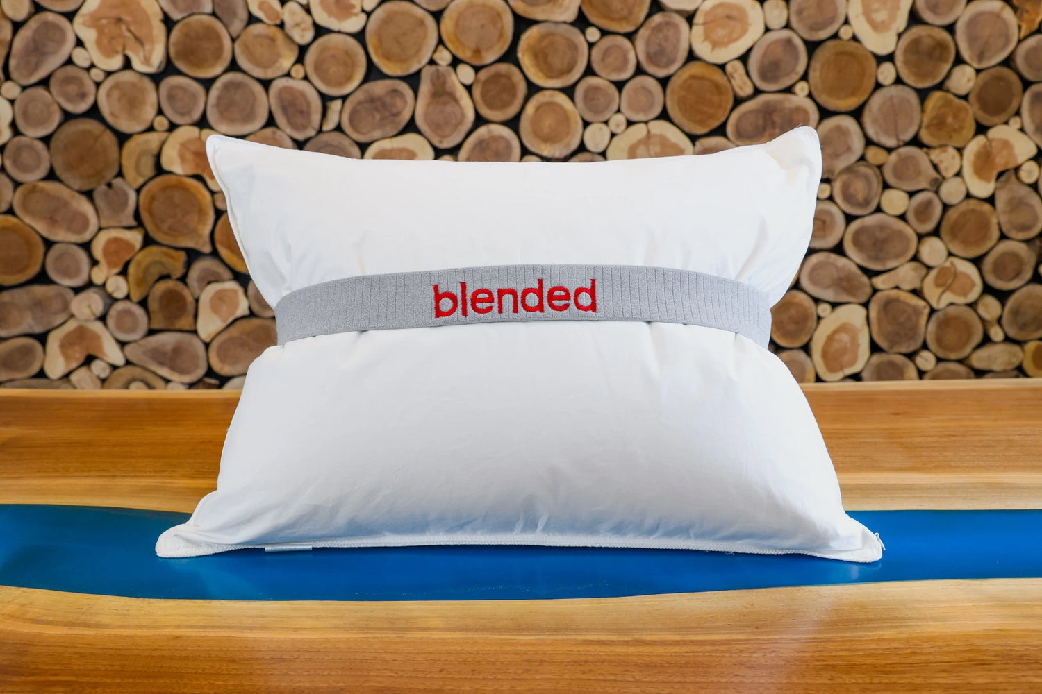 Pure down and feathers blended pillow by Guildcraft on a table.