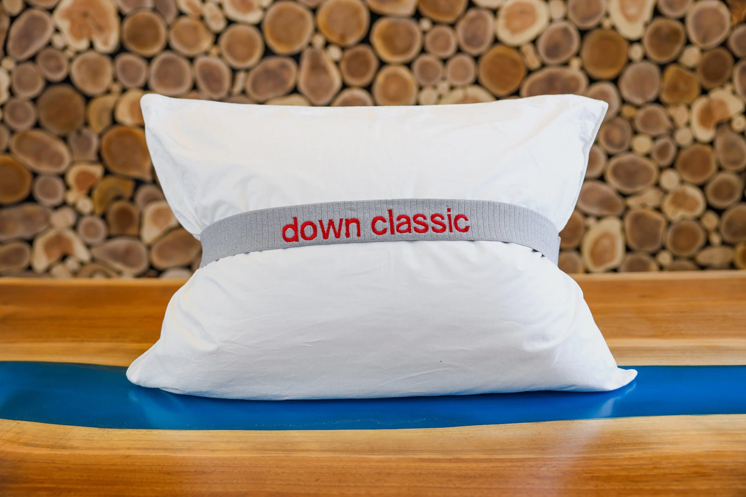 Pure down classic pillow propped up on a table.