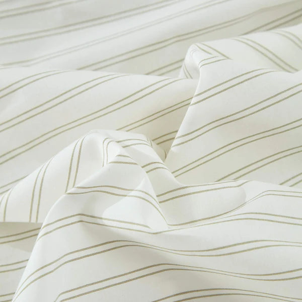 Close-up of textured fabric of Vale Green Duvet Cover Set with wavy lines on a white background