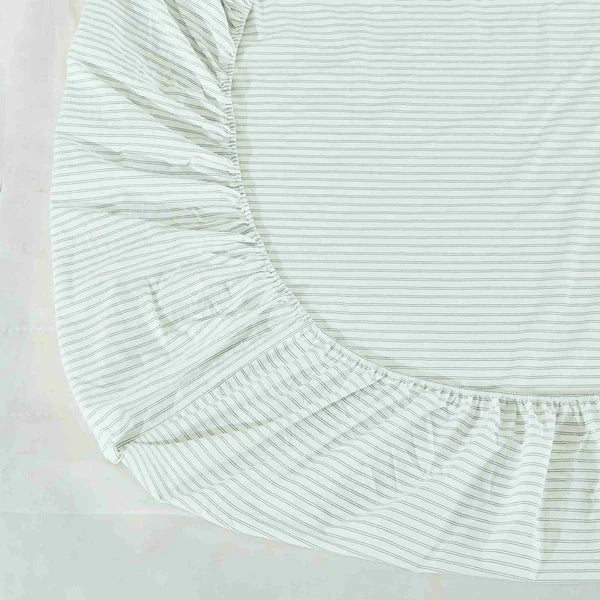Close-up of a light green striped fabric of a Vale Shadow Sheet Set