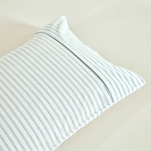 Striped pillowcase with blue and white stripes Vale Shadow Sheet Set on a beige background
