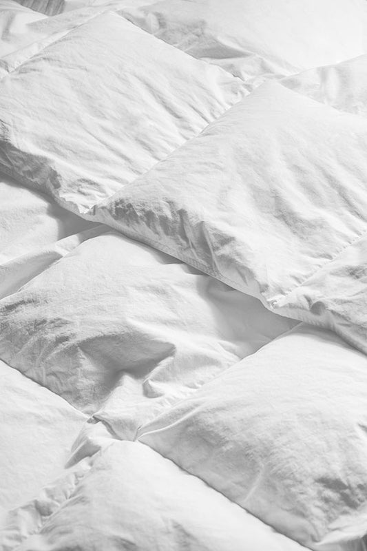 Closeup on summer weight duvet and it's baffle box construction.