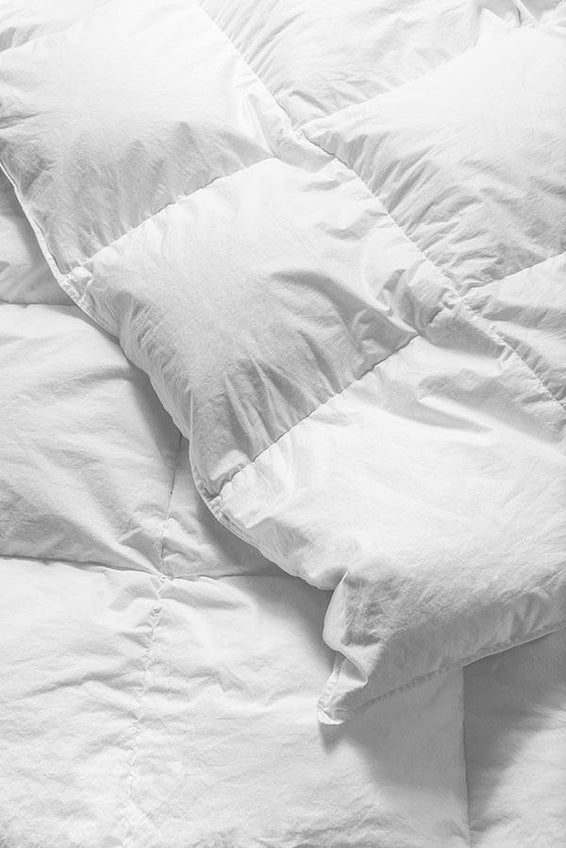 Closeup of a down duvet's cotton shell.