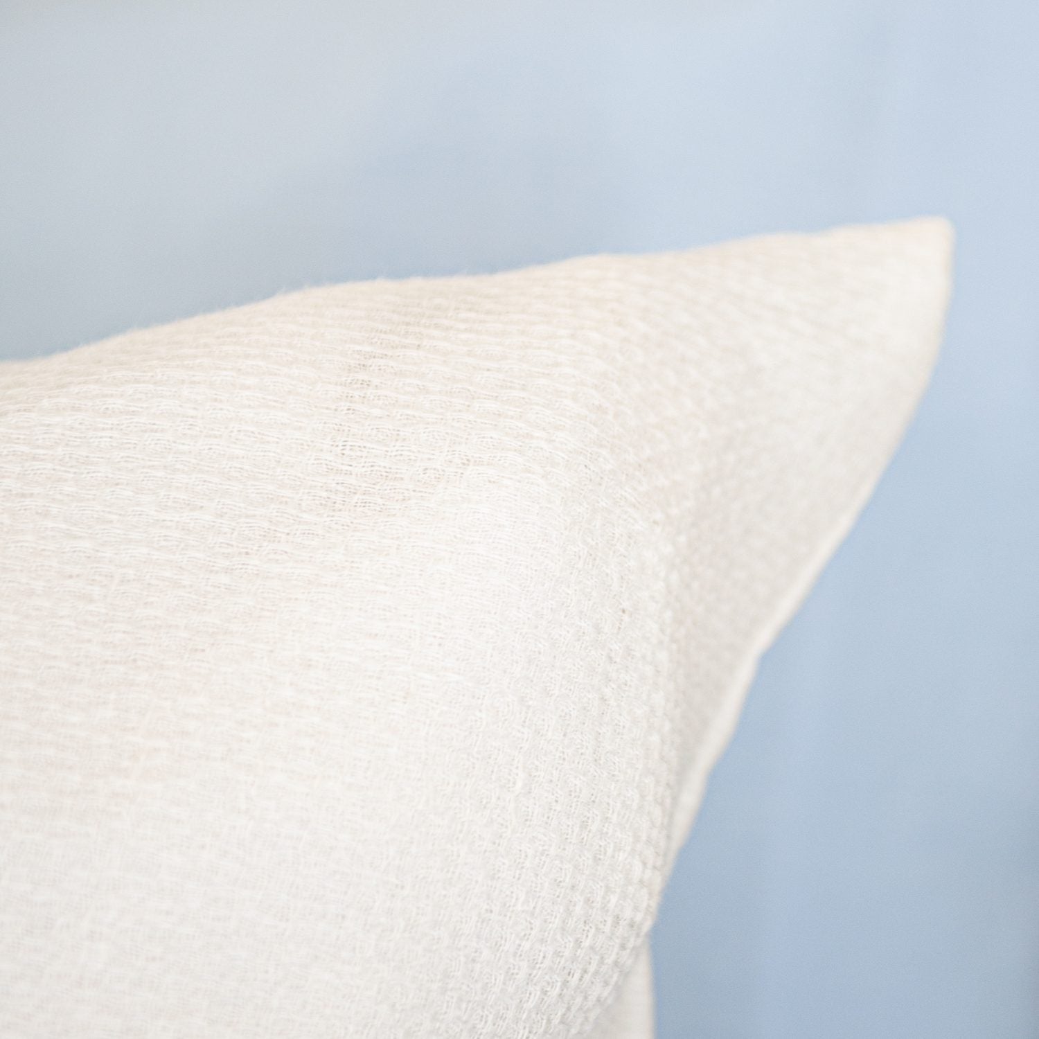 A detail of a Avalon Honeycomb Linen Cushion.