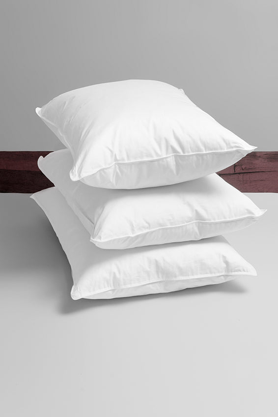 Pure down classic pillow on a bed.