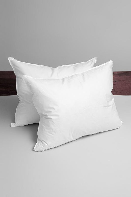 White down surround pillow on bed.